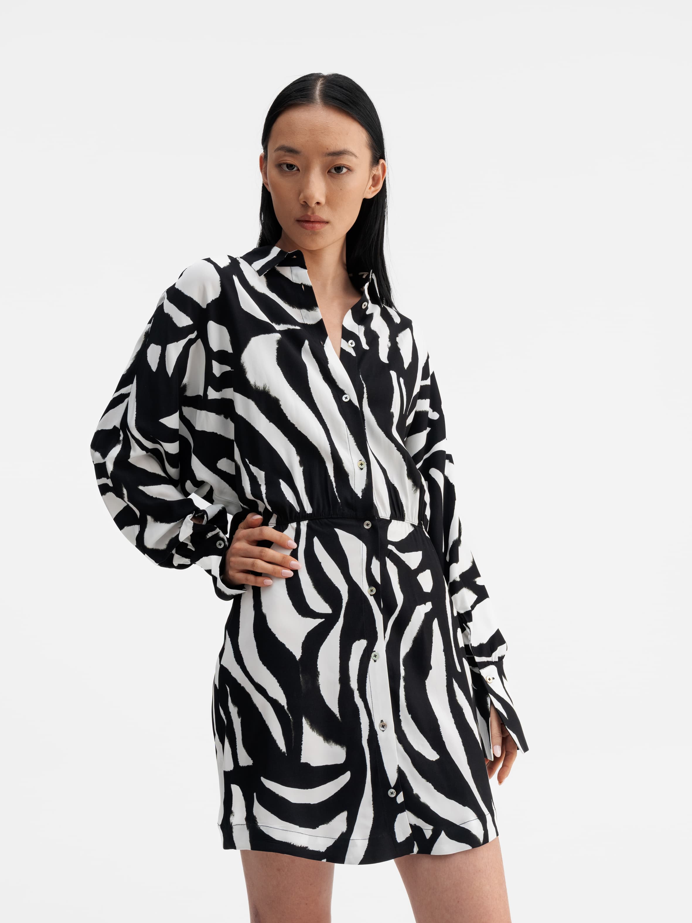 Model wearing Ahlvar Gallery Gia zebra shirt dress white