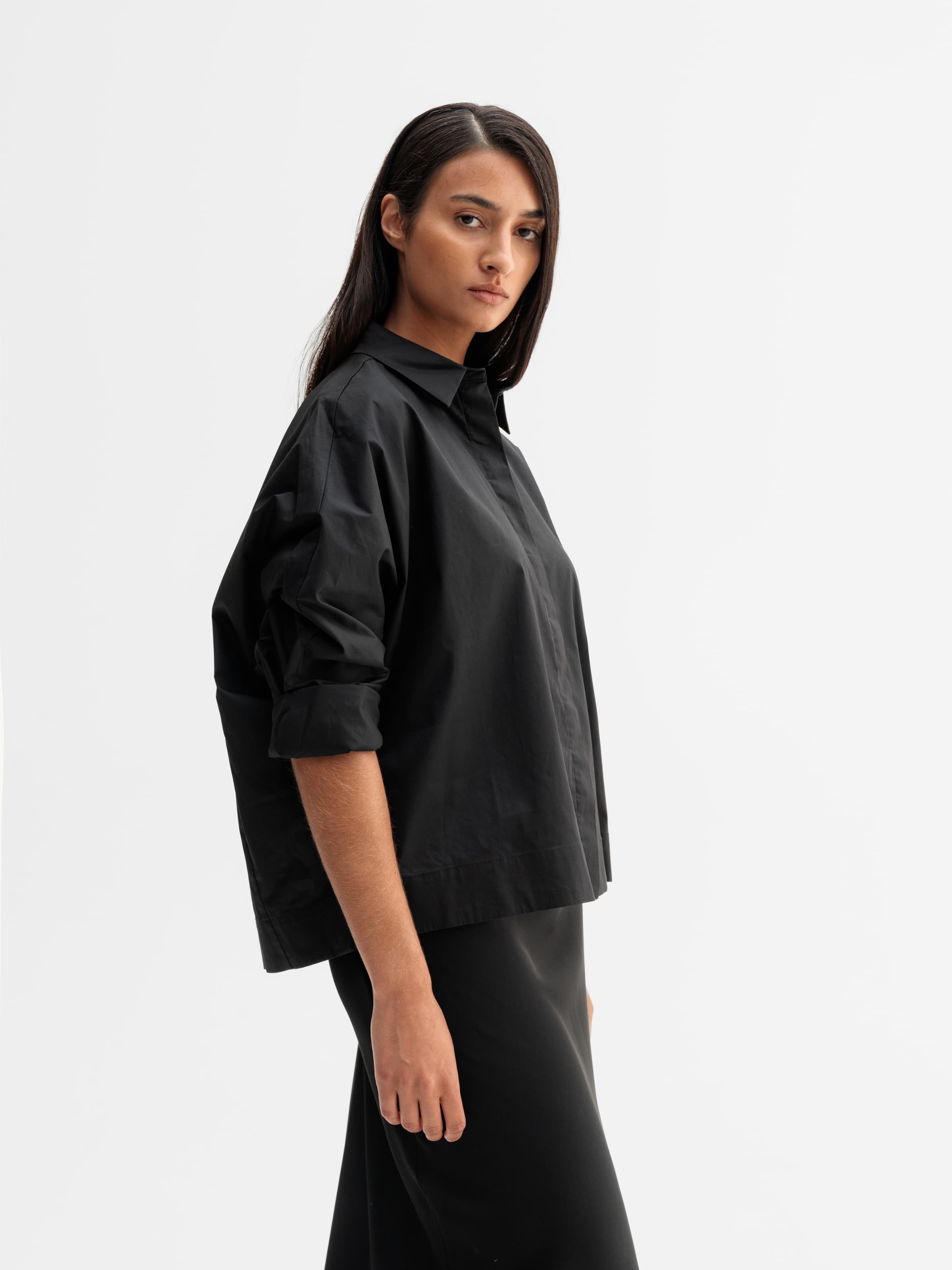 Model wearing Ahlvar Gallery Gigi shirt in Black