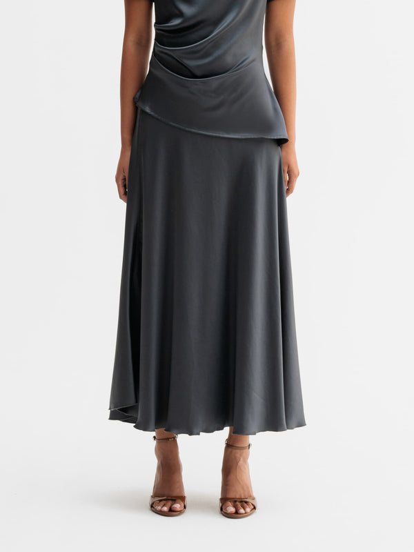 Model wearing Ahlvar Gallery Hadi satin skirt in Dark grey