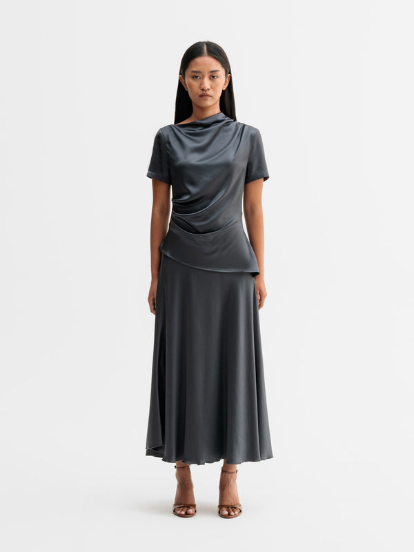 Model wearing Ahlvar Gallery Hadi satin skirt in Dark grey