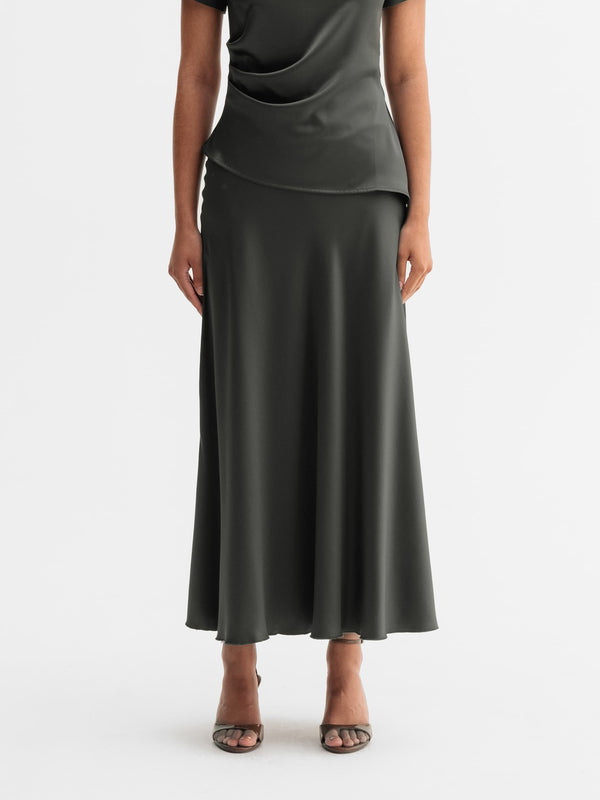 Model wearing Ahlvar Gallery Hadi satin skirt in Wood