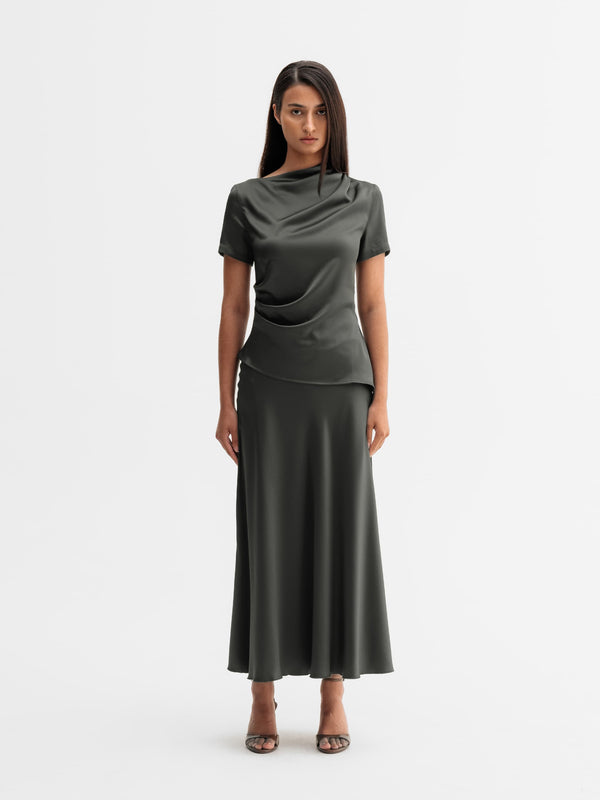 Model wearing Ahlvar Gallery Hadi satin skirt in Wood