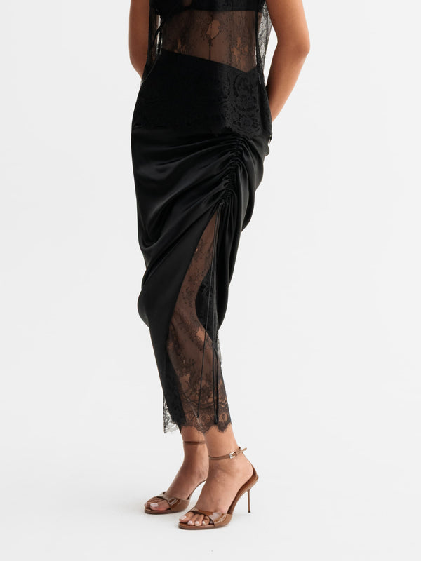 Model wearing Ahlvar Gallery Haley lace skirt in Black
