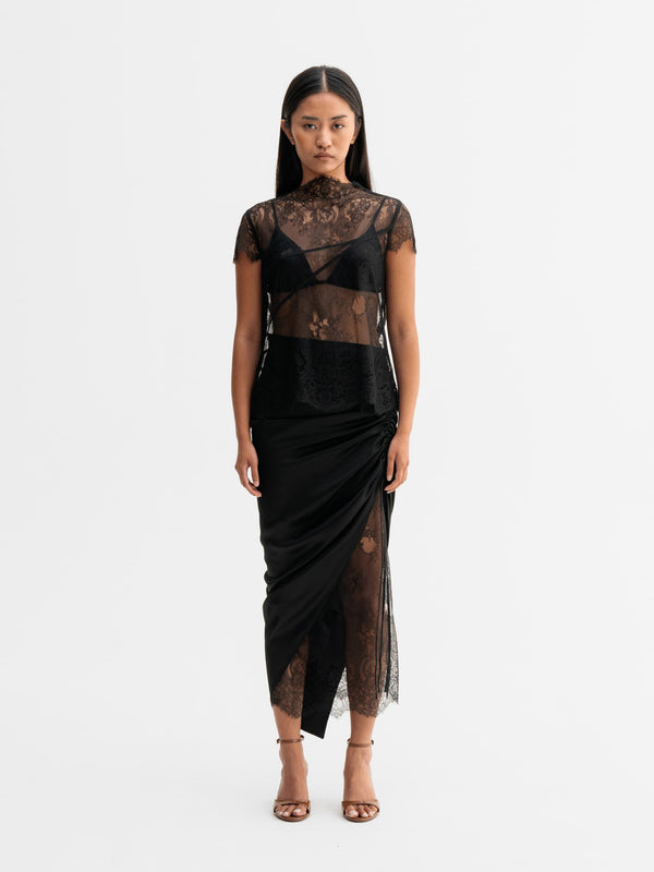 Model wearing Ahlvar Gallery Haley lace skirt in Black