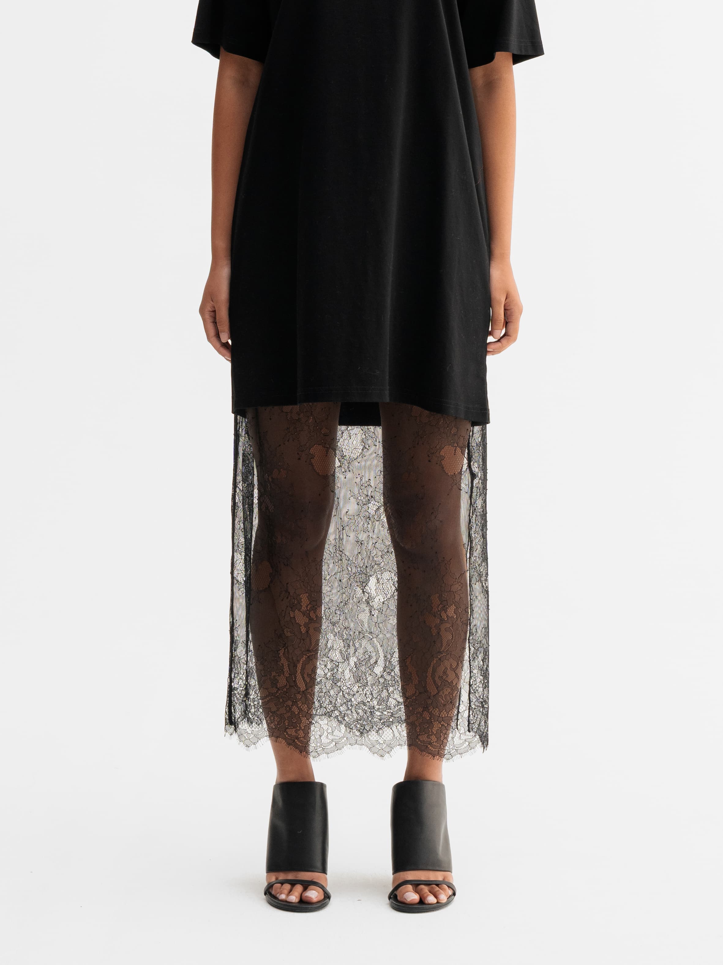 Model wearing Ahlvar Gallery Hana lace pencil skirt in Black