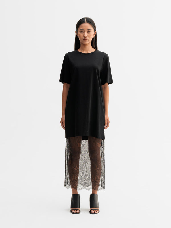 Model wearing Ahlvar Gallery Hana lace pencil skirt in Black