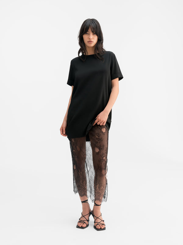 Model wearing Ahlvar Gallery Hana lace pencil skirt black