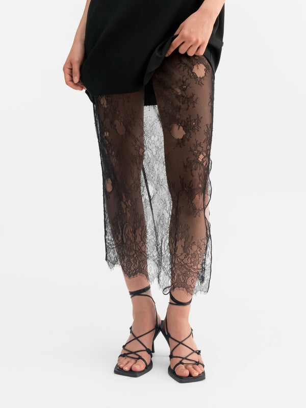Model wearing Ahlvar Gallery Hana lace pencil skirt black