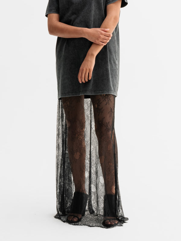 Model wearing Ahlvar Gallery Hana long lace skirt in Black