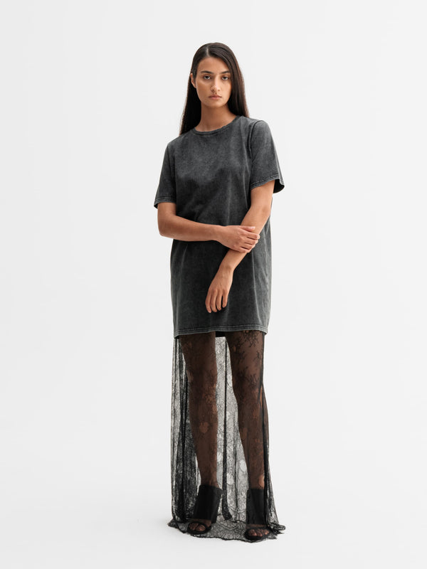 Model wearing Ahlvar Gallery Hana long lace skirt in Black