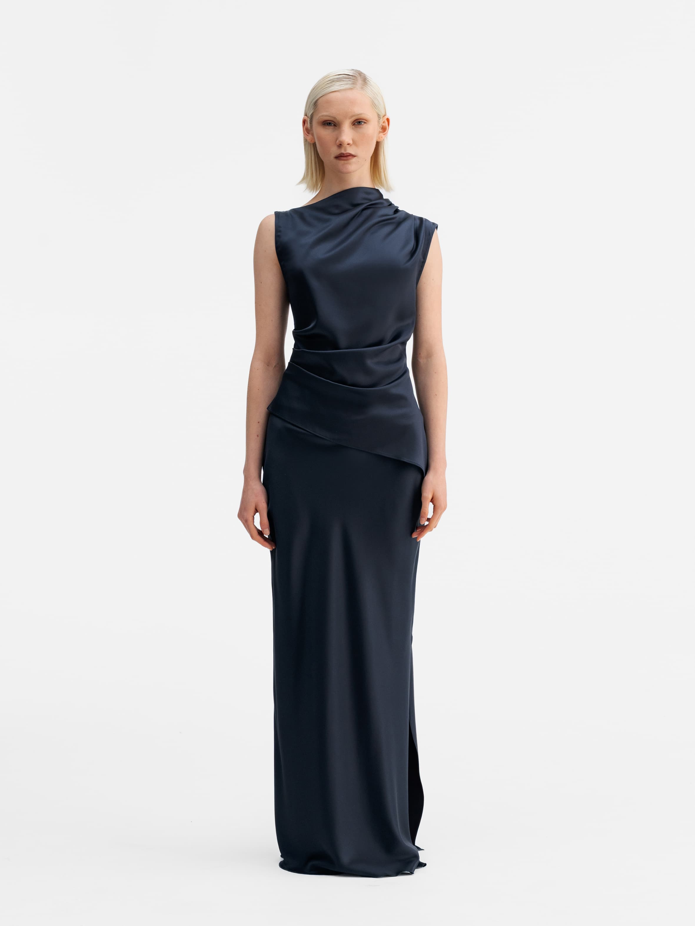 Model wearing Ahlvar Gallery Hana long logo satin skirt blue grey