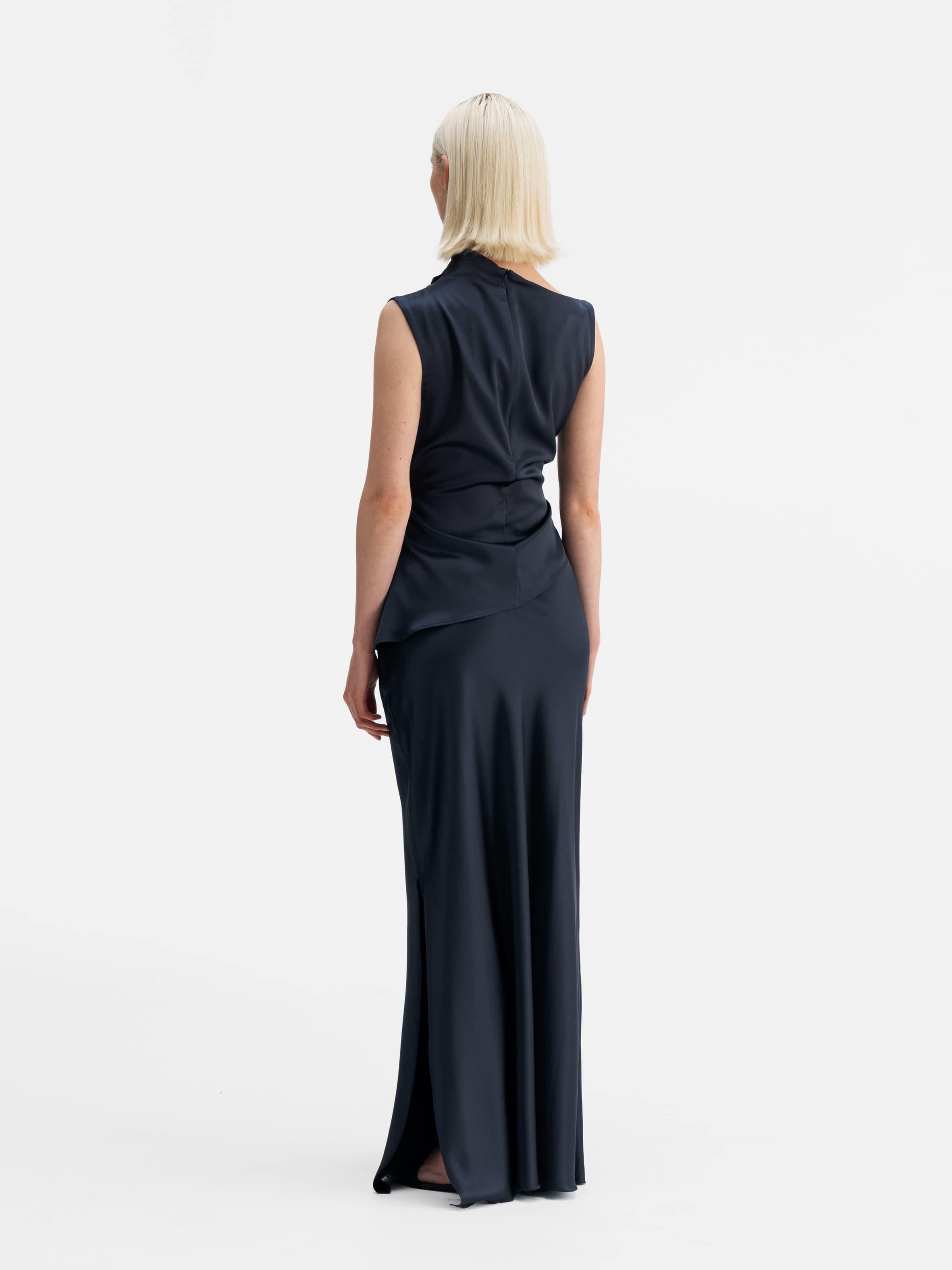 Back view of Ahlvar Gallery Hana long logo satin skirt blue grey