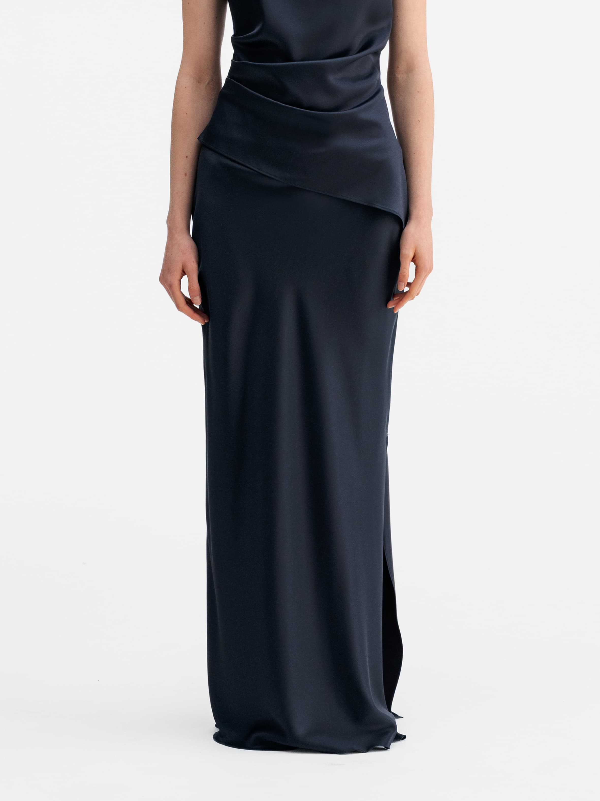 Model wearing Ahlvar Gallery Hana long logo satin skirt blue grey