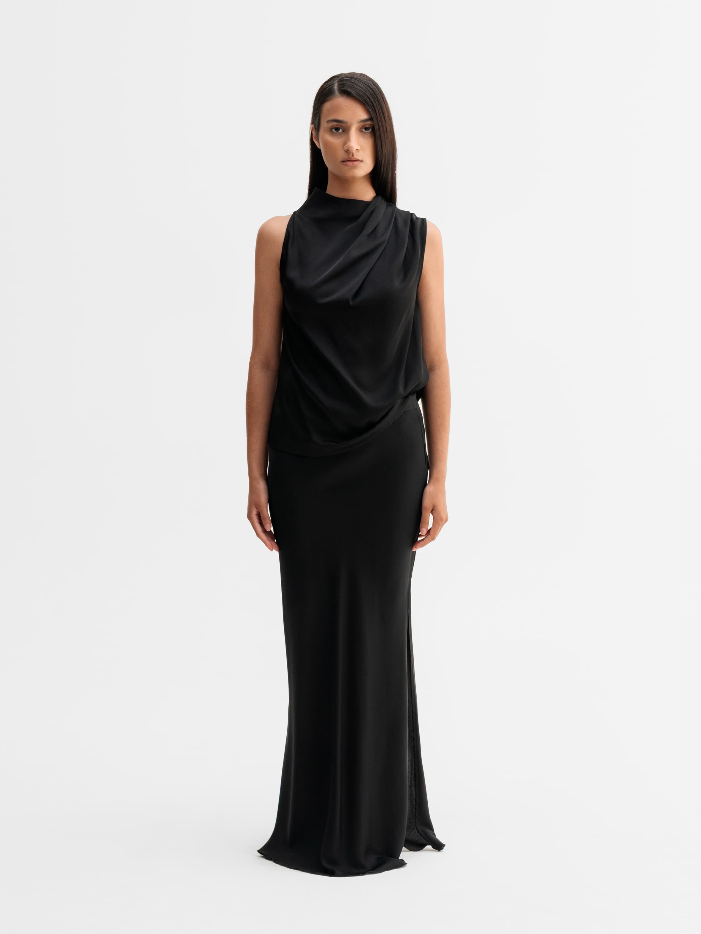 Model wearing Ahlvar Gallery Hana long silk skirt in Black