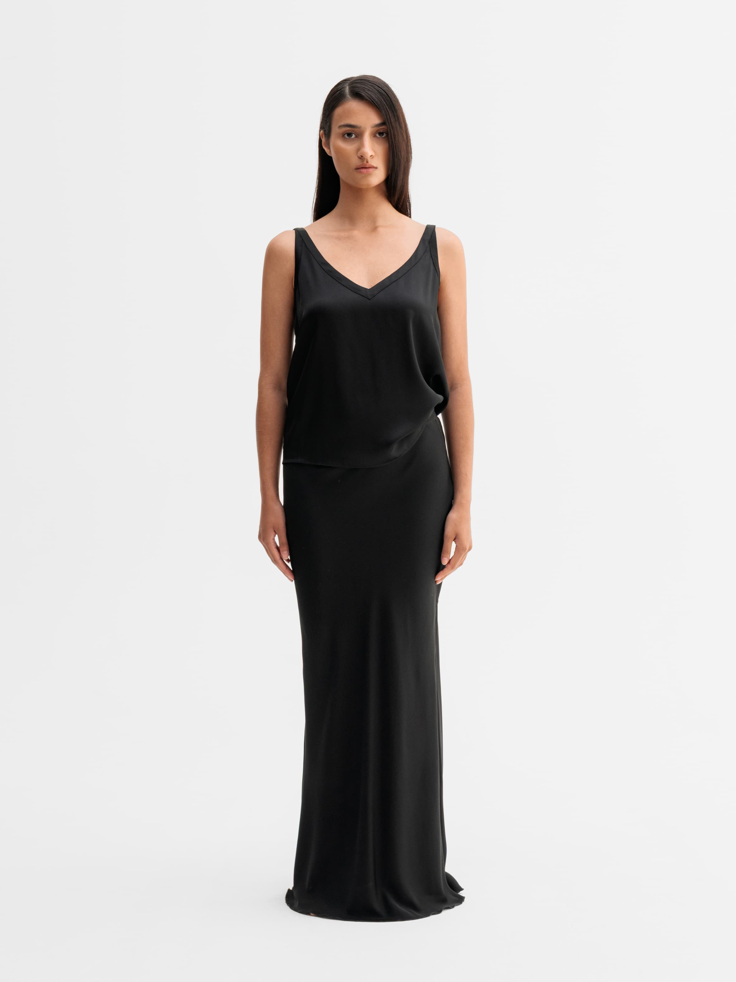 Model wearing Ahlvar Gallery Hana long silk skirt in Black