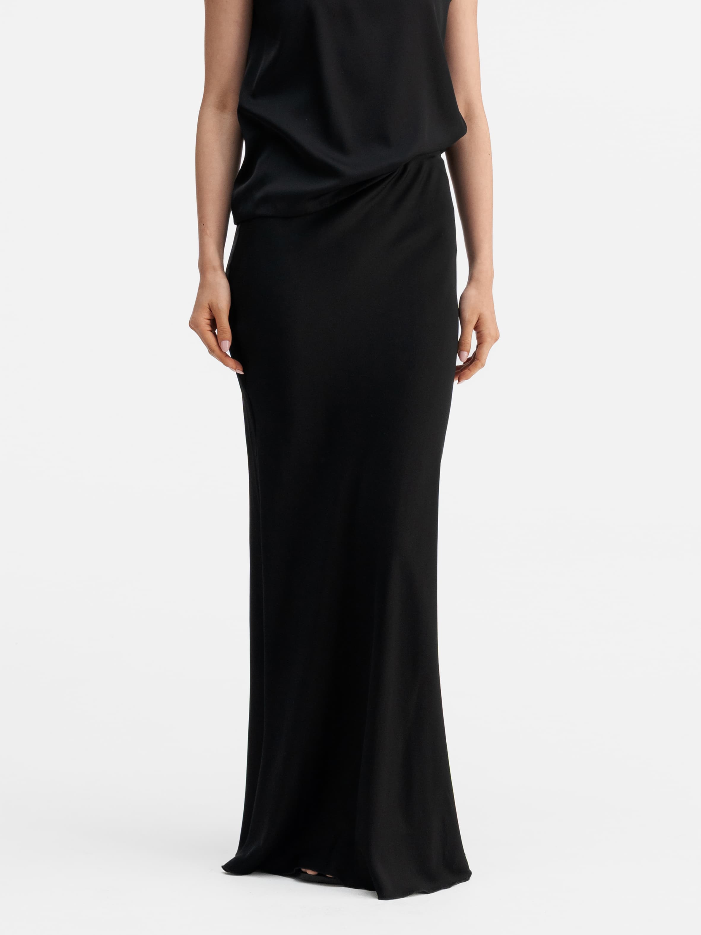 Model wearing Ahlvar Gallery Hana long silk skirt black