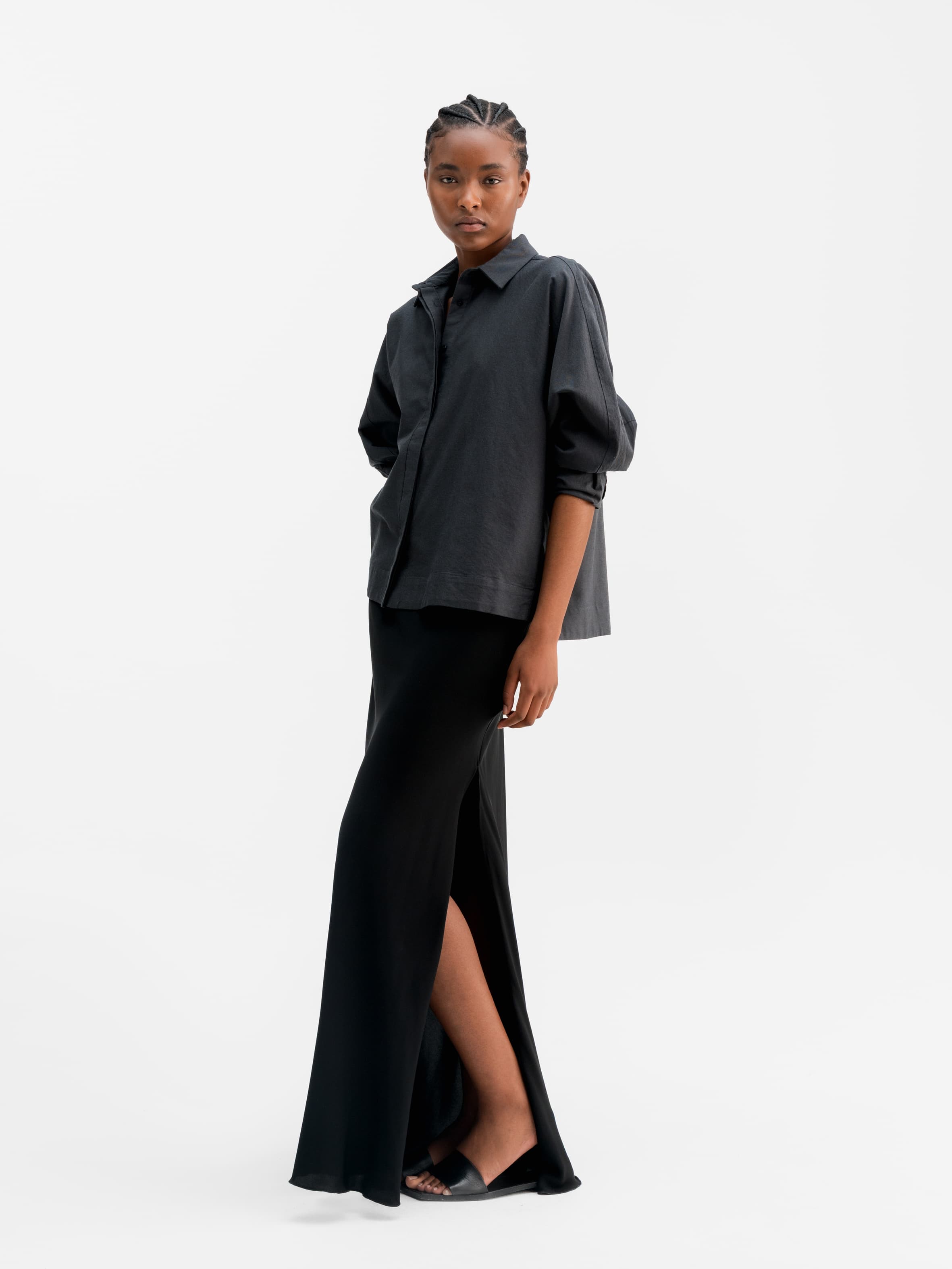 Model wearing Ahlvar Gallery Hana long silk skirt black