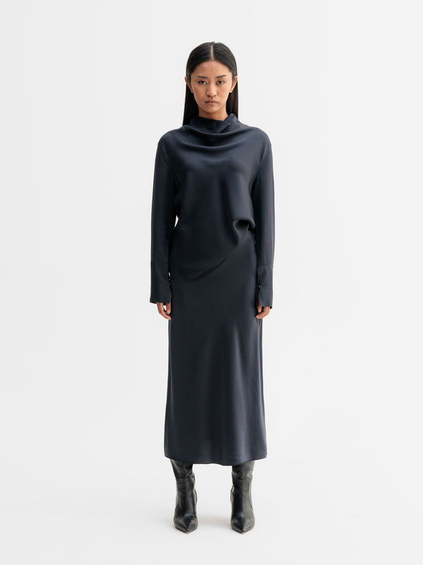 Model wearing Ahlvar Gallery Hana satin silk skirt in Blue grey
