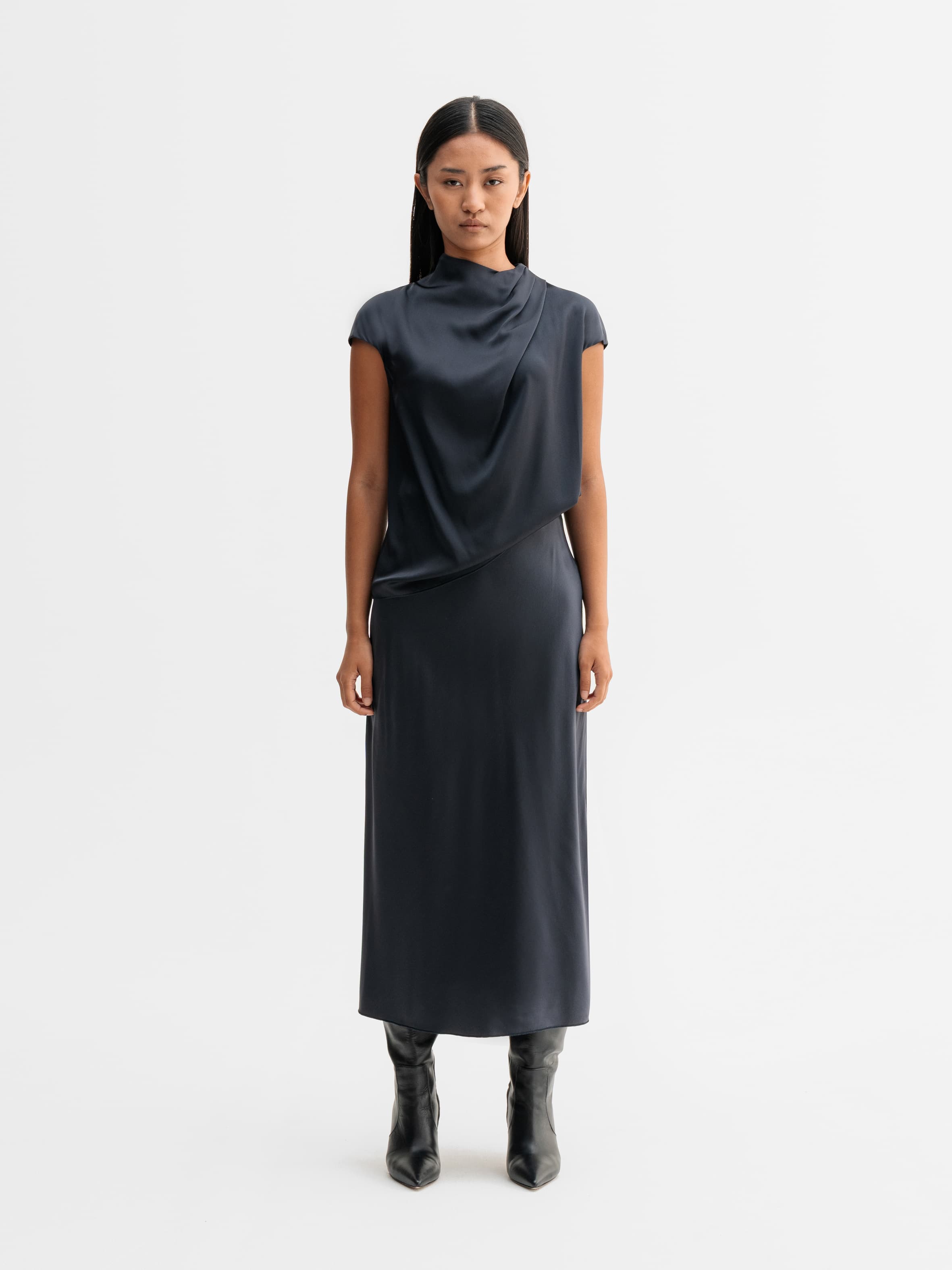 Model wearing Ahlvar Gallery Hana satin silk skirt in Blue grey