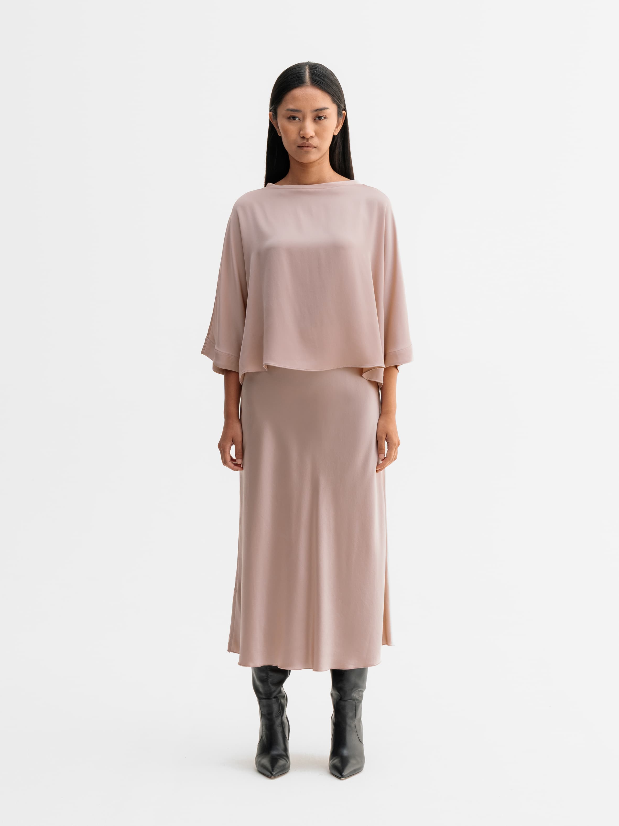 Model wearing Ahlvar Gallery Hana satin silk skirt in Dusty pink