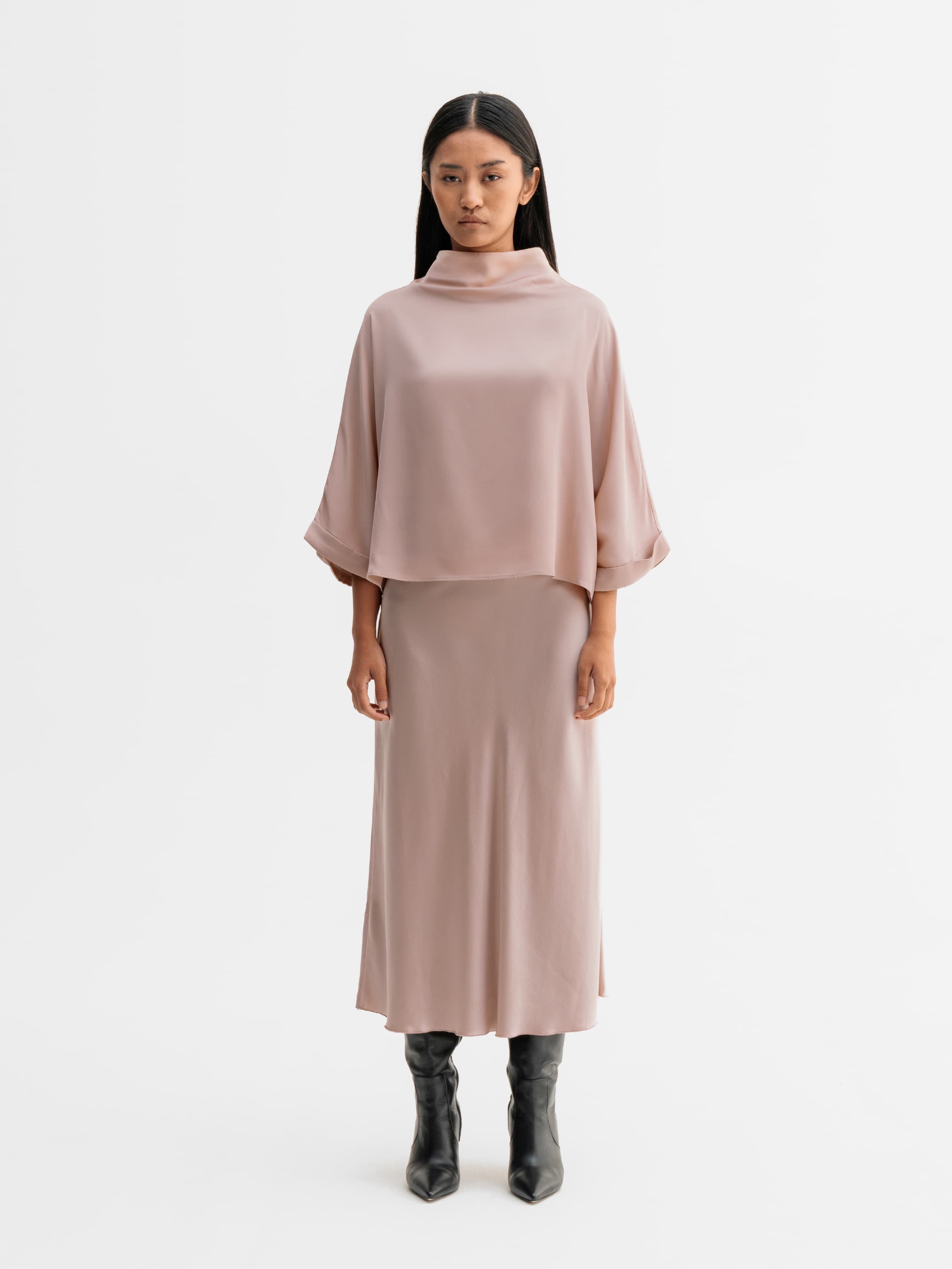 Model wearing Ahlvar Gallery Hana satin silk skirt in Dusty pink