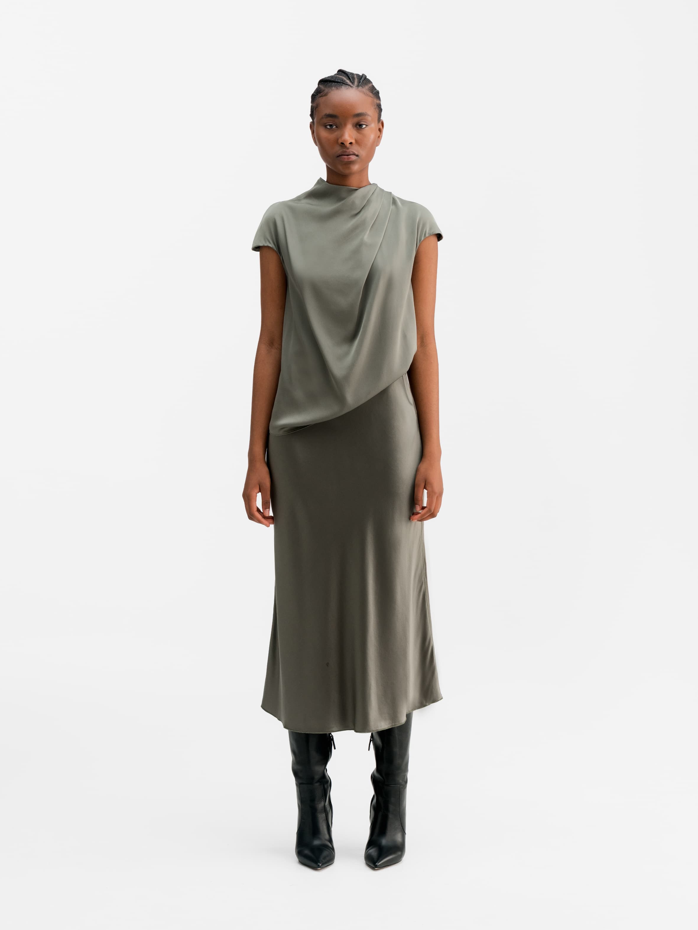 Model wearing Ahlvar Gallery Hana satin silk skirt light military