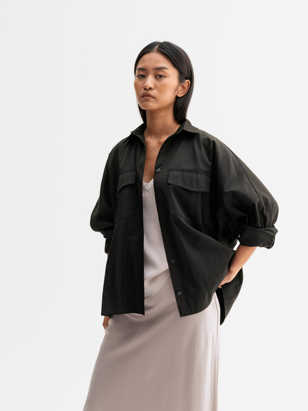 Model wearing Ahlvar Gallery Kaia over shirt in Black