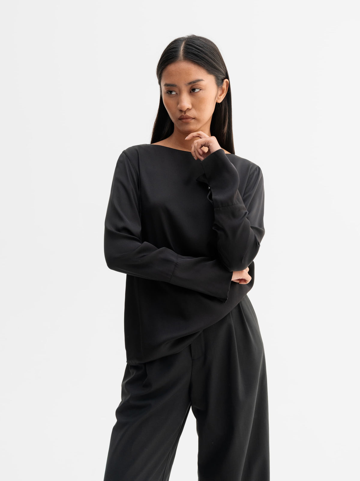 Model wearing Ahlvar Gallery Kelly silk blouse in Black