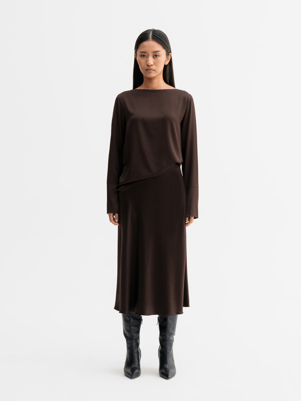 Model wearing Ahlvar Gallery Kelly silk blouse in Dark brown