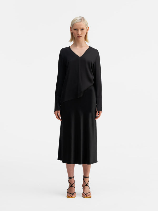Model wearing Ahlvar Gallery Kelly v-neck silk blouse black