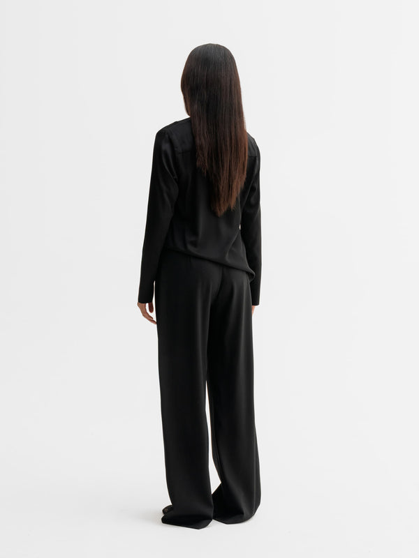 Back view of Ahlvar Gallery Kelly v-neck silk blouse in Black