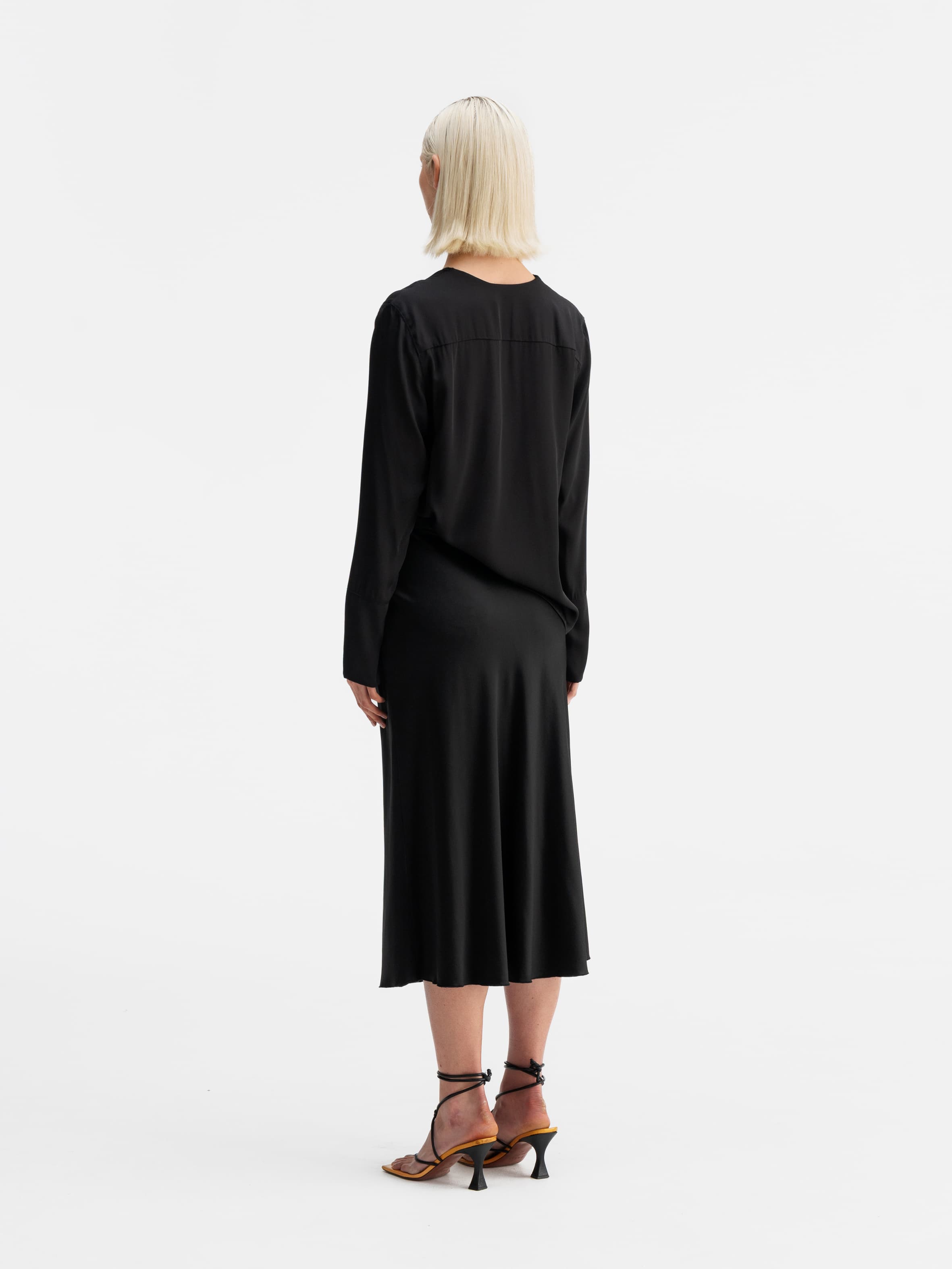 Back view of Ahlvar Gallery Kelly v-neck silk blouse black