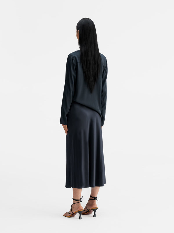 Back view of Ahlvar Gallery Kelly v-neck silk blouse blue grey