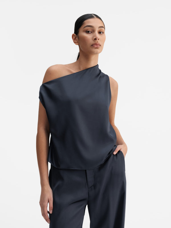 Model wearing Ahlvar Gallery Lacy satin tank blue grey