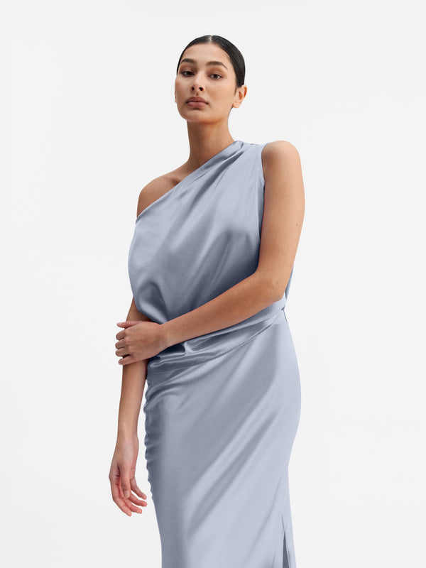 Model wearing Ahlvar Gallery Lacy satin tank denim blue
