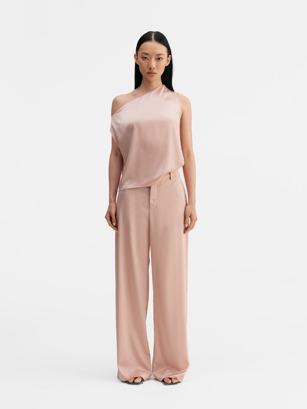 Model wearing Ahlvar Gallery Lacy satin tank dusty pink