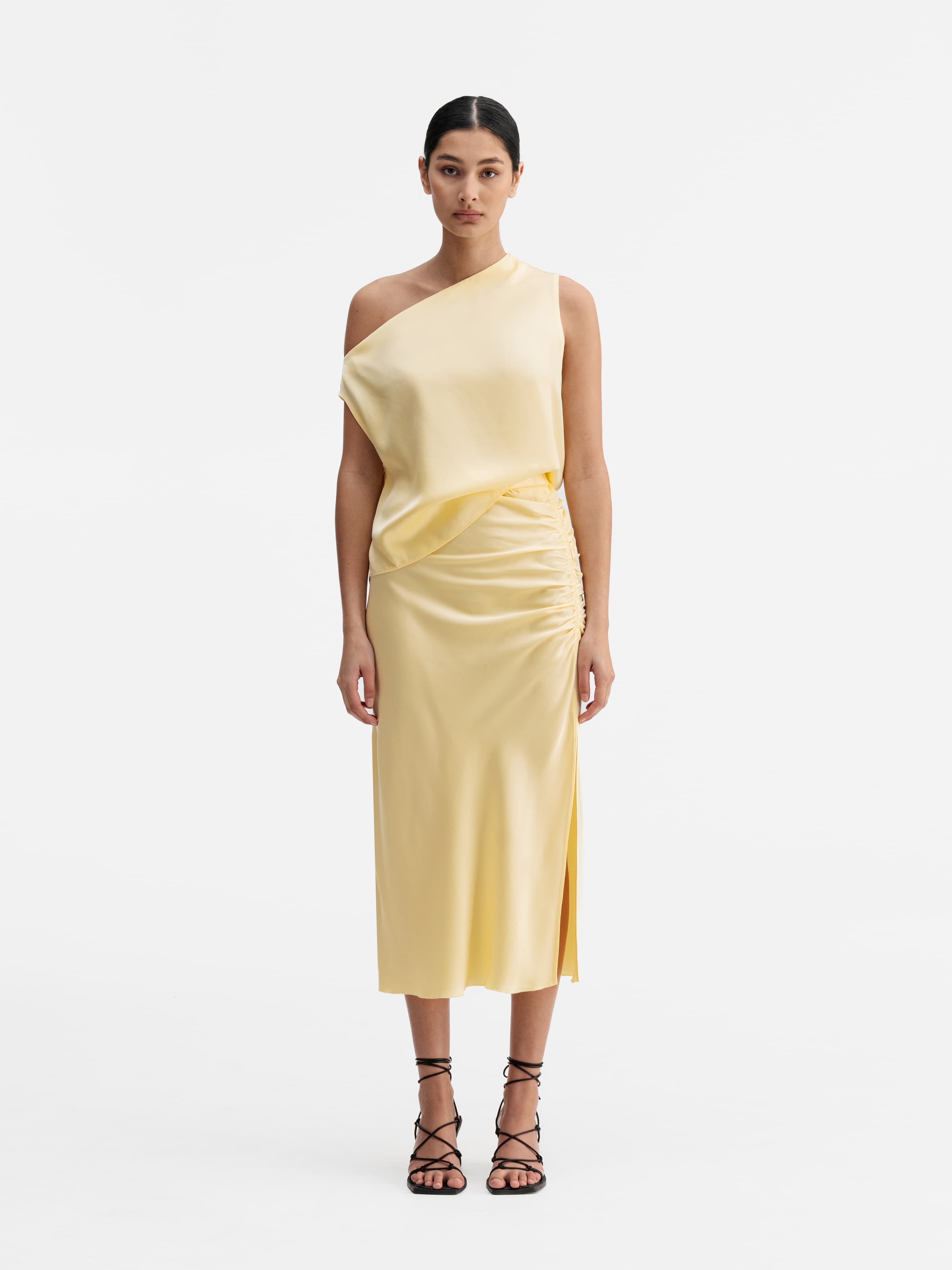 Model wearing Ahlvar Gallery Lacy satin tank light yellow