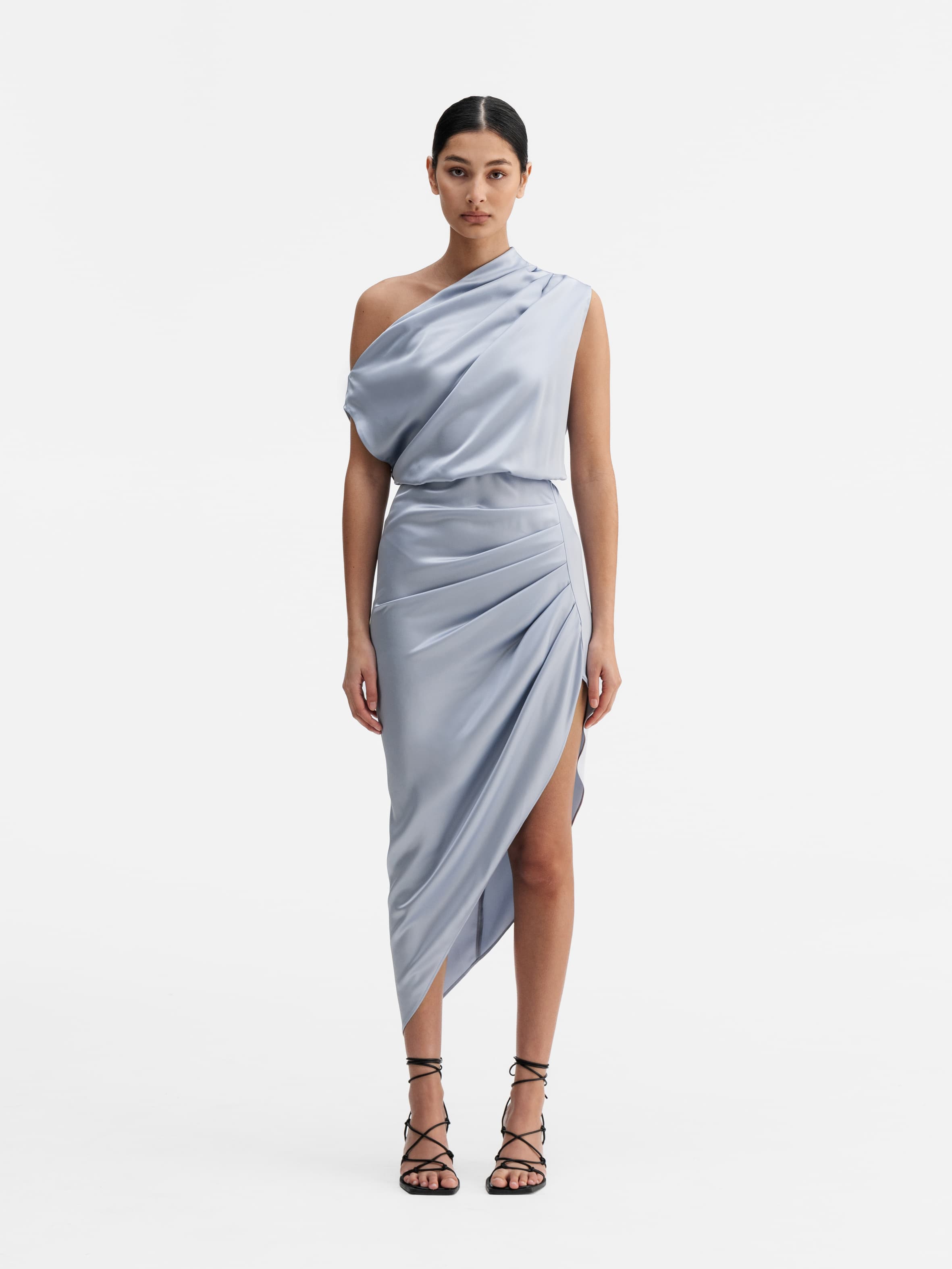Model wearing Ahlvar Gallery Lana satin dress denim blue