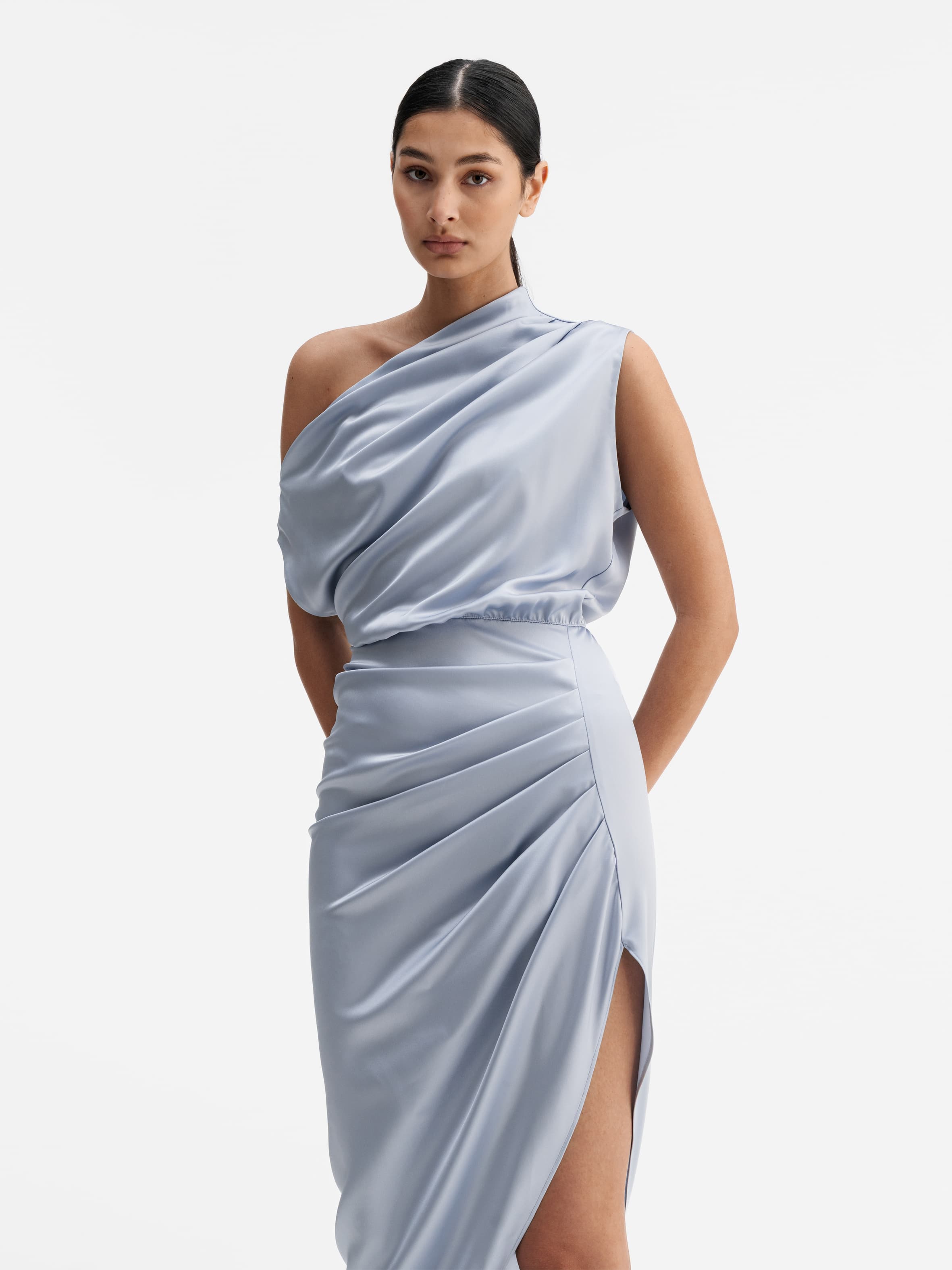 Model wearing Ahlvar Gallery Lana satin dress denim blue