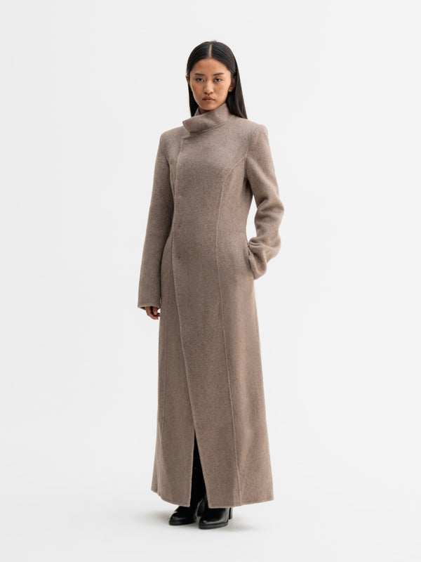 Model wearing Ahlvar Gallery Leia wool coat in Light brown