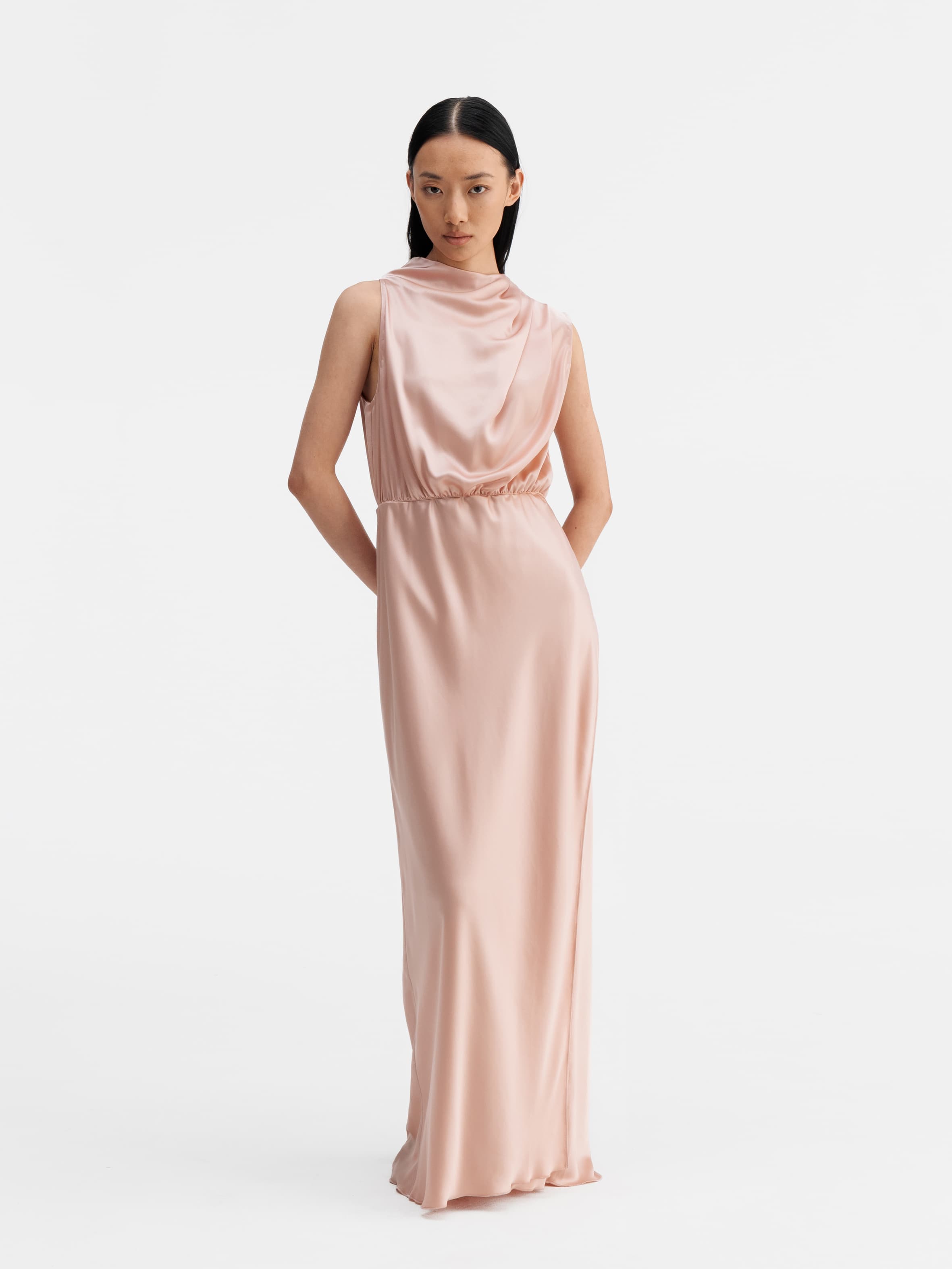 Model wearing Ahlvar Gallery Lima satin dress dusty pink