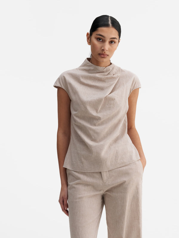Model wearing Ahlvar Gallery Lima linen top cream