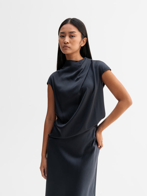 Model wearing Ahlvar Gallery Lima silk top in Blue grey