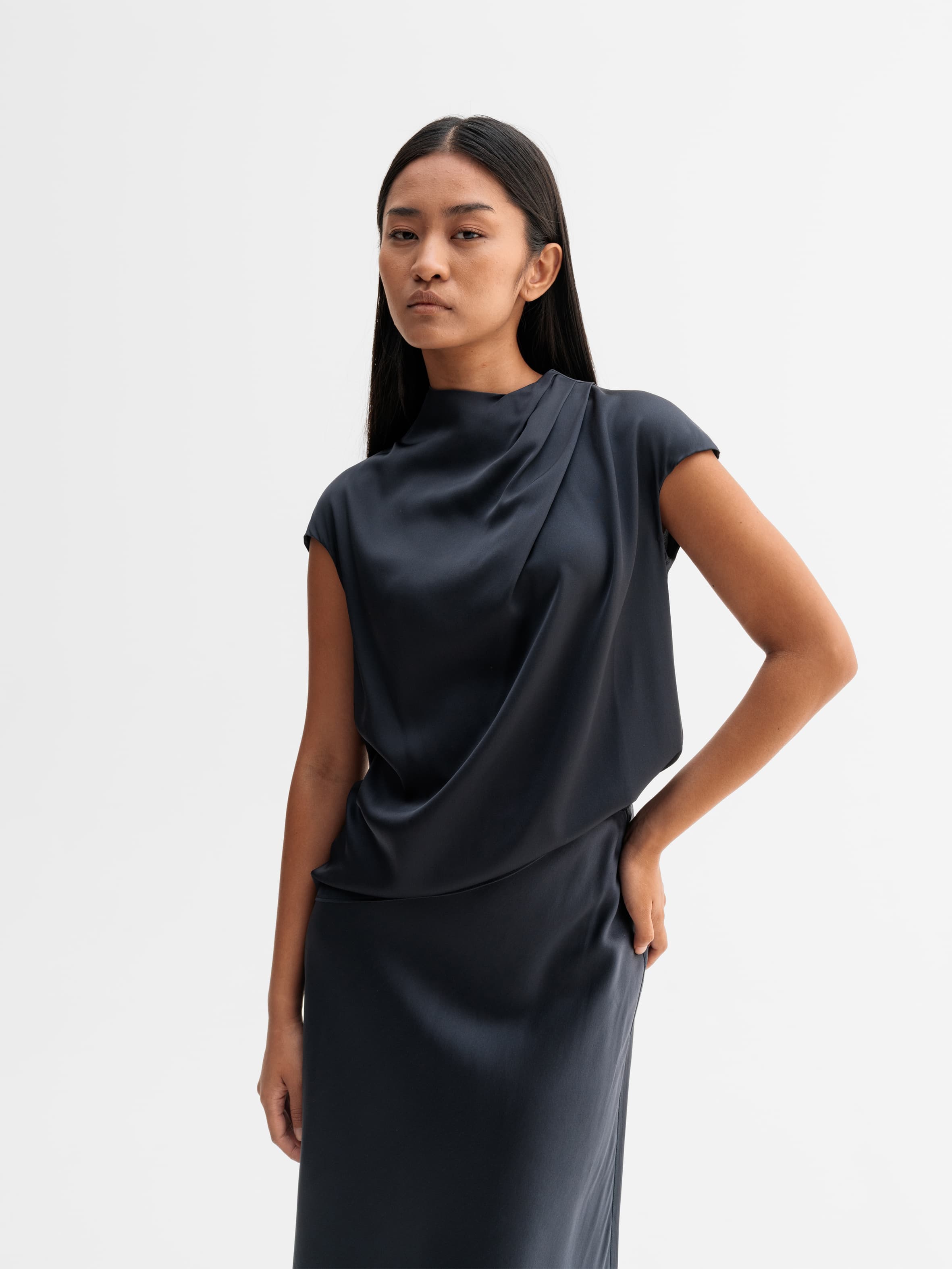 Model wearing Ahlvar Gallery Lima silk top in Blue grey