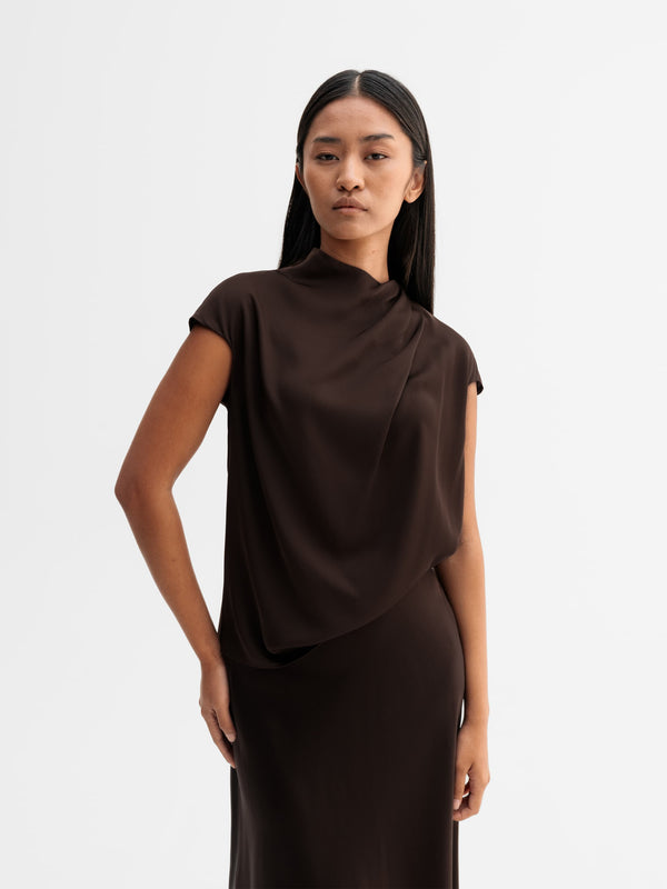 Model wearing Ahlvar Gallery Lima silk top in Dark brown