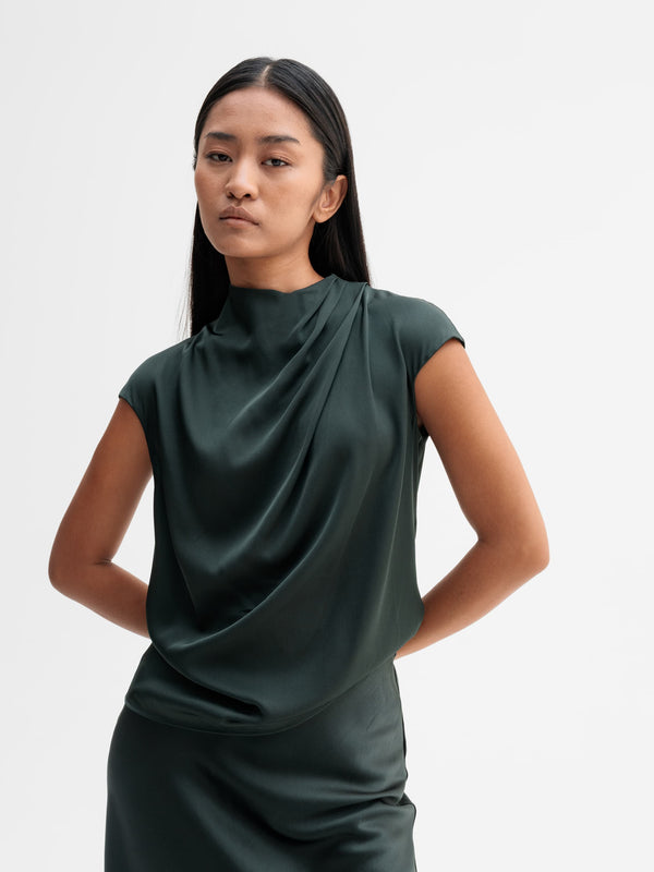 Model wearing Ahlvar Gallery Lima silk top in Deep forest