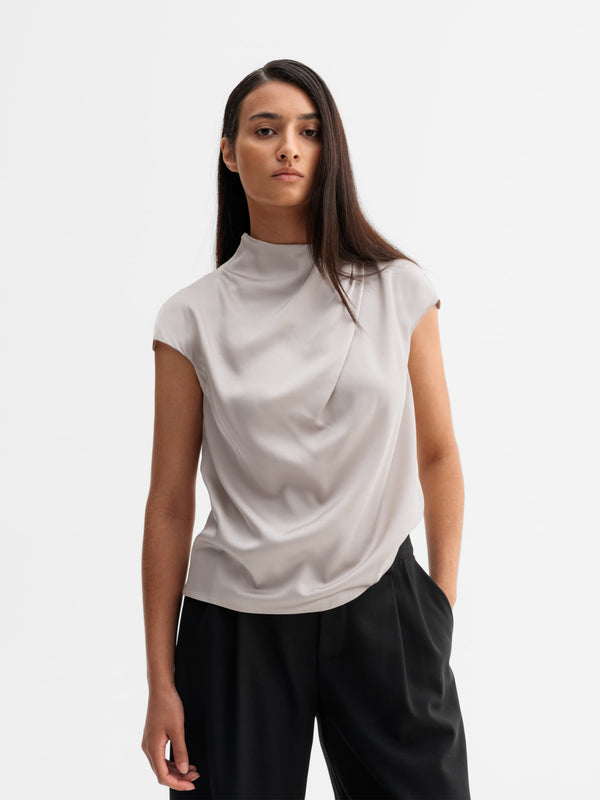 Model wearing Ahlvar Gallery Lima silk top in Greige