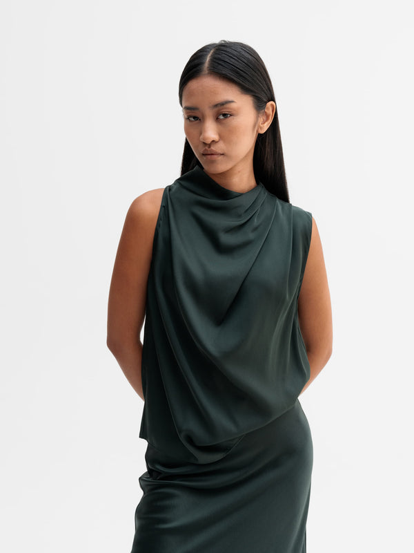 Model wearing Ahlvar Gallery Lima silk tank in Deep forest
