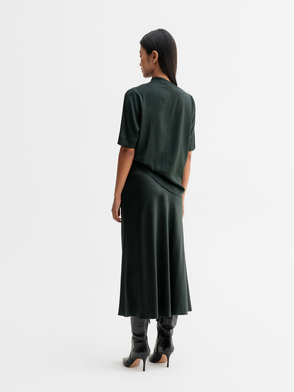 Back view of Ahlvar Gallery Lima silk tee in Deep forest