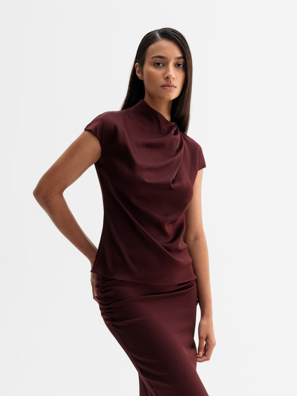 Model wearing Ahlvar Gallery Lima top in Burgundy